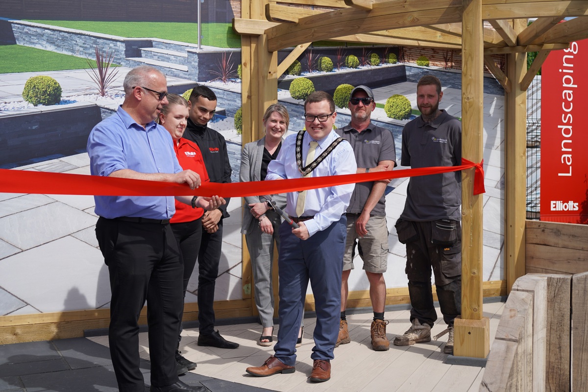 Paul Wareham, Branch Manager (left) with members of the Elliotts branch team and DH Landscapes with the Mayor cutting the ribbon