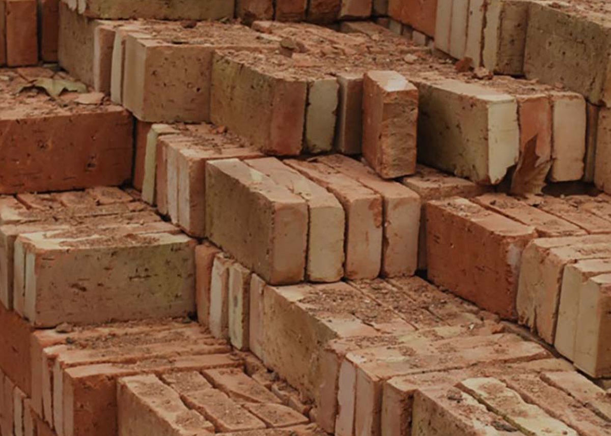 Pile of red construction bricks