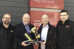DeWalt's General Sales Manager, Mick Gill, presents a 175th anniversary commemorative trophy to Elliotts Chariman, Stuart Mason-Elliott