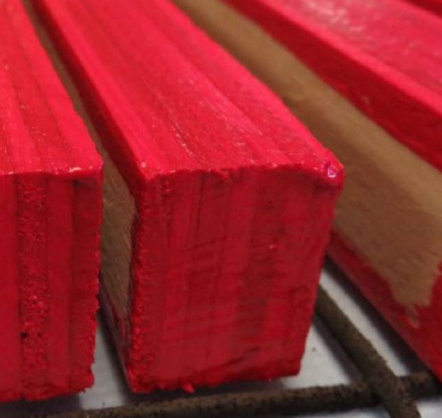 Cuts of plywood sealed in red Protek Edge Seal Protection