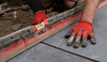 Using a spirit level when laying Vitripiazza porcelain paving